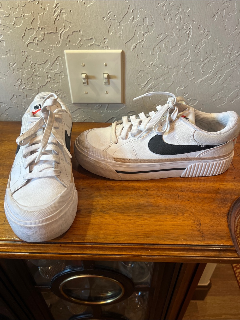Nike White Low-Top Sneakers with Black Swoosh Accent